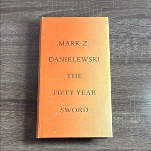 Mark Z. Danielewski Orange Hardcover Book 'The Fifty Year Sword'